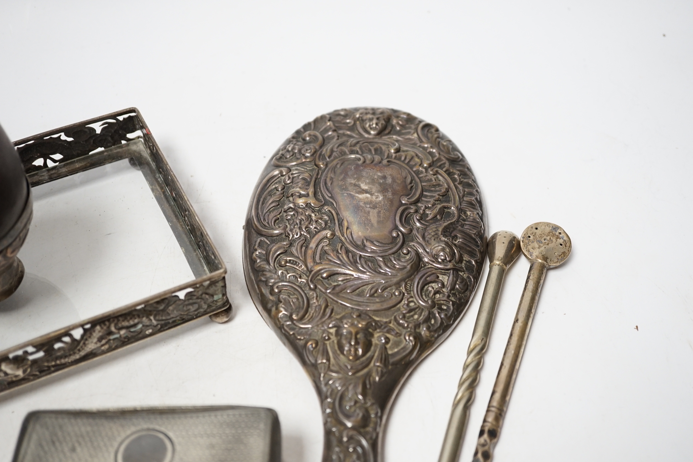 An Edwardian silver mounted travelling pocket watch case, Birmingham, 1905, with nickel cased pocket watch, together with a repousse silver mounted hand mirror, a Chinese white metal mounted glass dressing table tray and